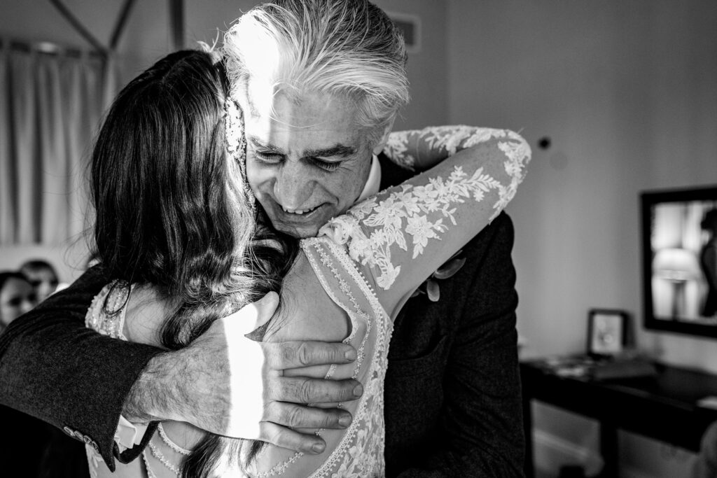 Emotional father and bride hug during Bowood Hotel wedding morning