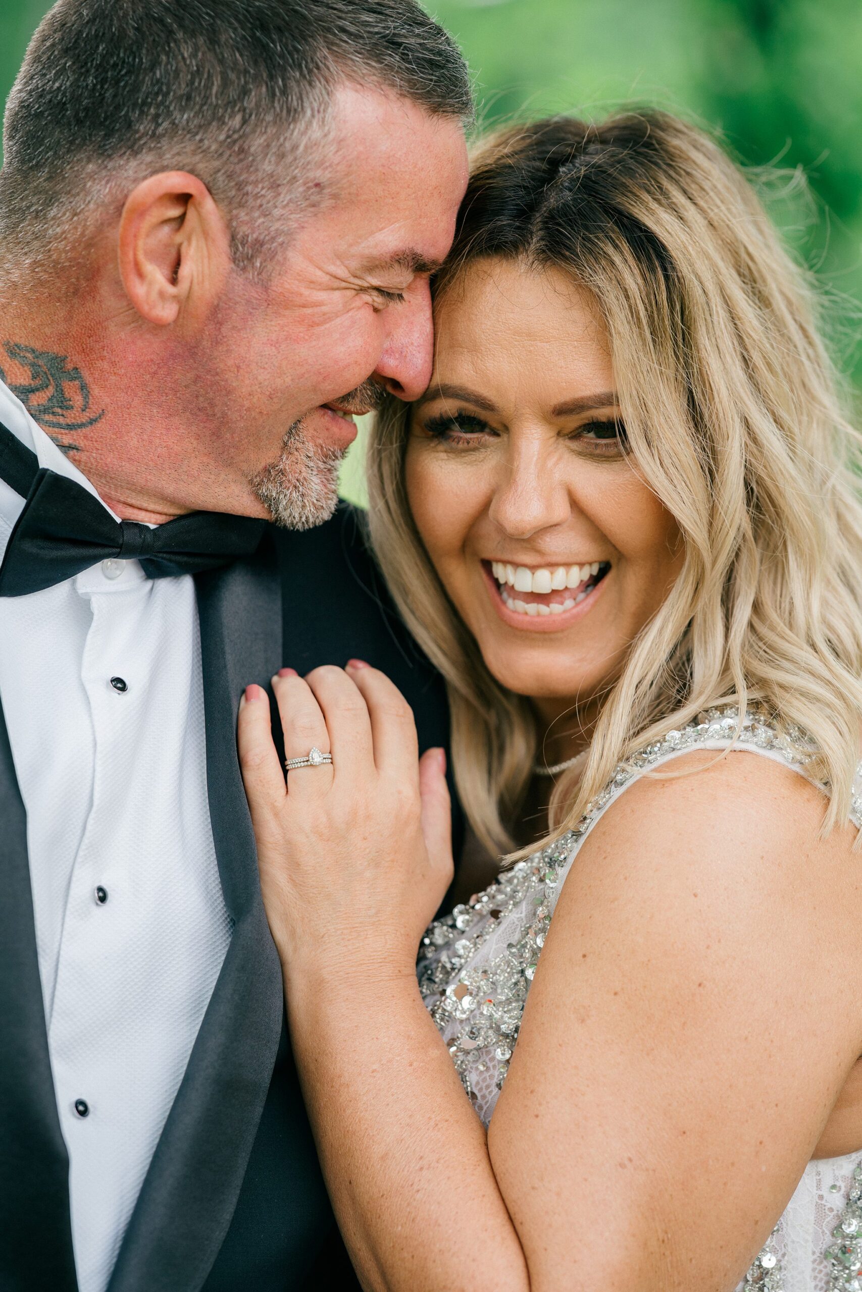 Bride and groom laughing together at Berwick Lodge, capturing natural emotion.